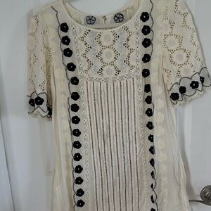 Anthropologie’s Floreat Ivory Lace Top with Dark Floral Details